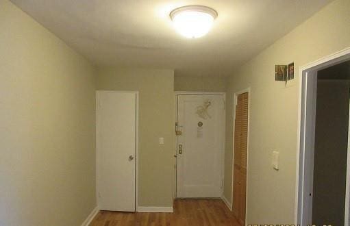 2244 Bronx Park E Unit 6L, Bronx, NY 10467 - hallway with wood finished floors and baseboards