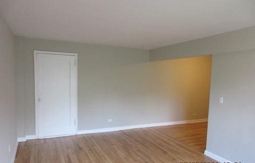 spare room with light hardwood / wood-style floors