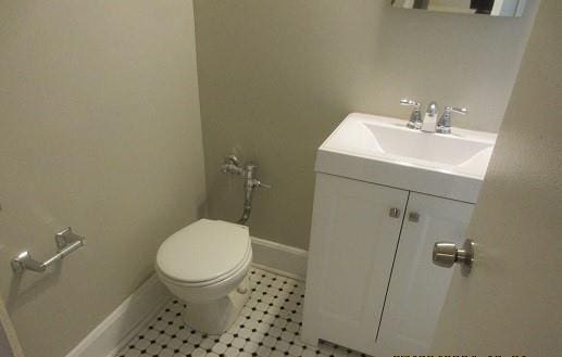 2244 Bronx Park E Unit 6L, Bronx, NY 10467 - bathroom featuring vanity, toilet, and baseboards