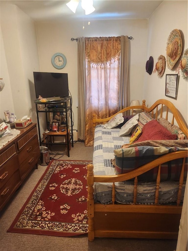 bedroom featuring ceiling fan and light colored carpet