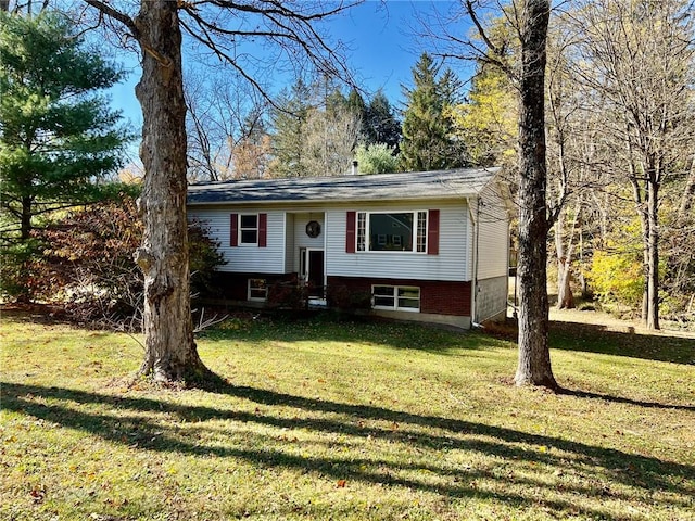 raised ranch featuring a front yard