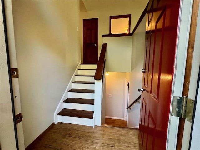 stairway featuring hardwood / wood-style floors