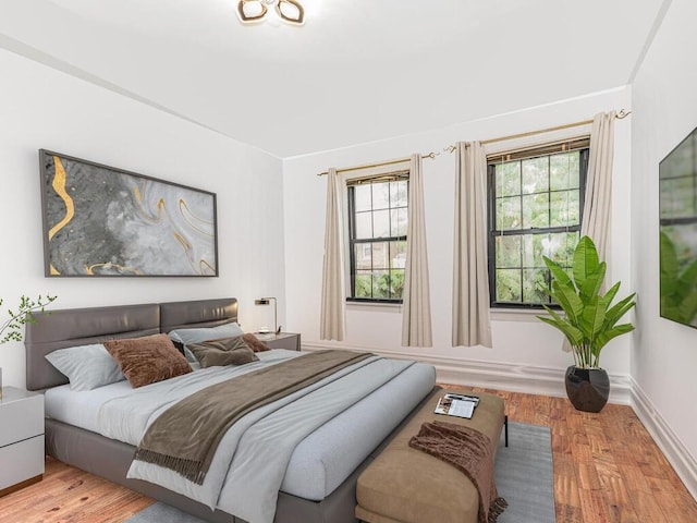 bedroom with light wood-type flooring