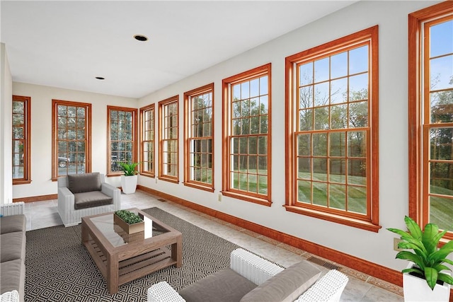 sunroom / solarium featuring plenty of natural light