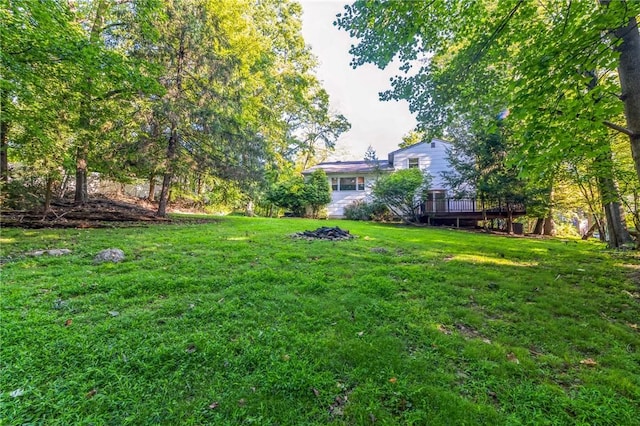 view of yard with a wooden deck