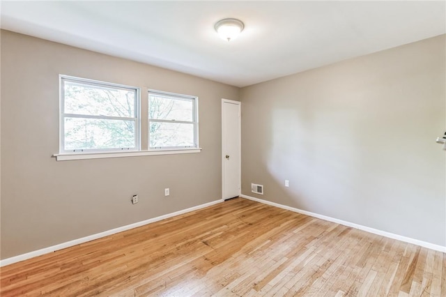 spare room with light wood-type flooring