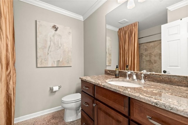 bathroom featuring vanity, toilet, and crown molding