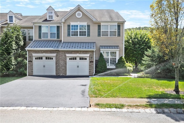 view of front of house featuring a garage and a front yard