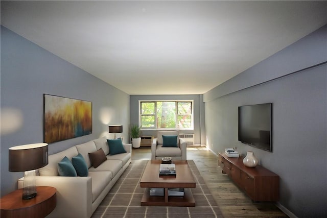 living room with radiator heating unit and dark hardwood / wood-style floors