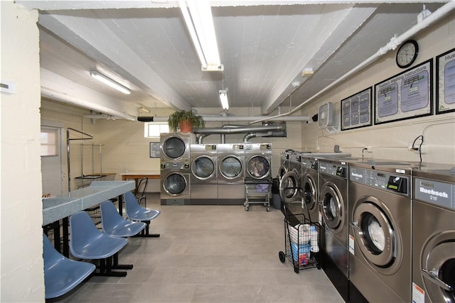 laundry area with separate washer and dryer and stacked washer / dryer