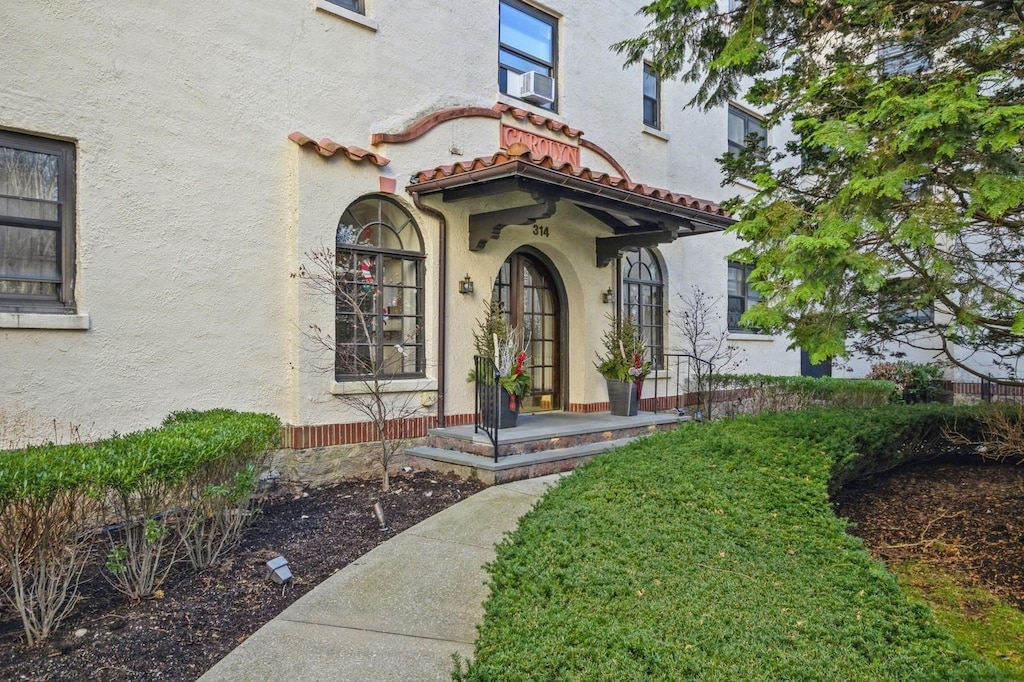 property entrance featuring cooling unit