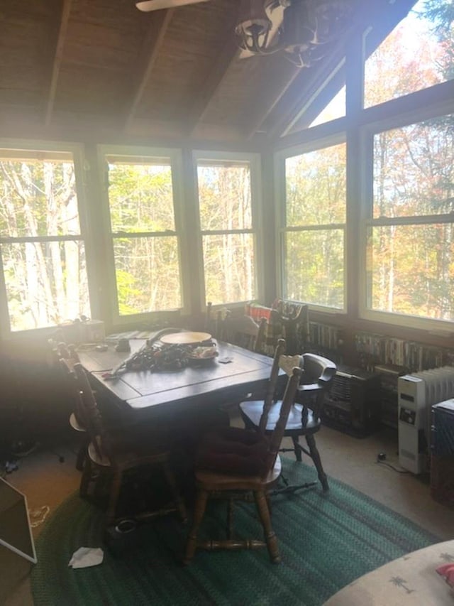 sunroom featuring lofted ceiling