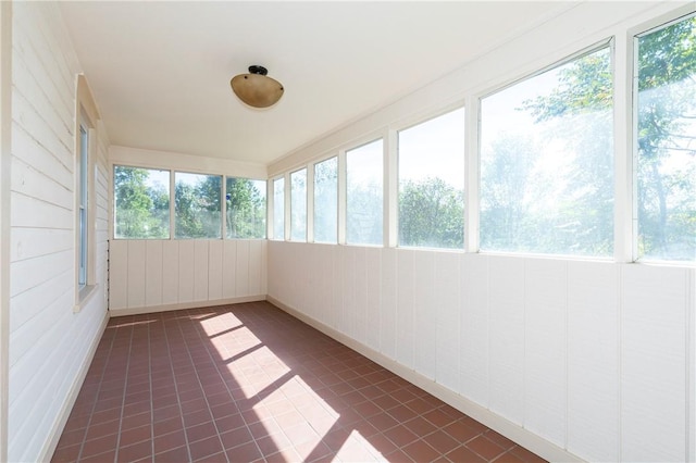 unfurnished sunroom featuring a wealth of natural light