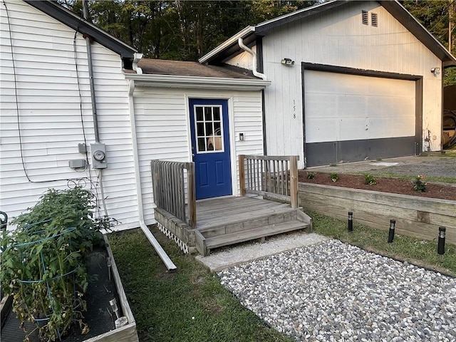 view of exterior entry featuring a garage