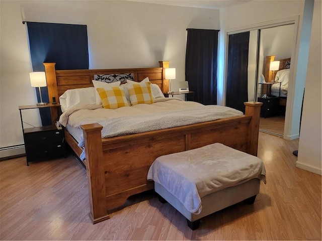 bedroom featuring light wood-type flooring and a closet