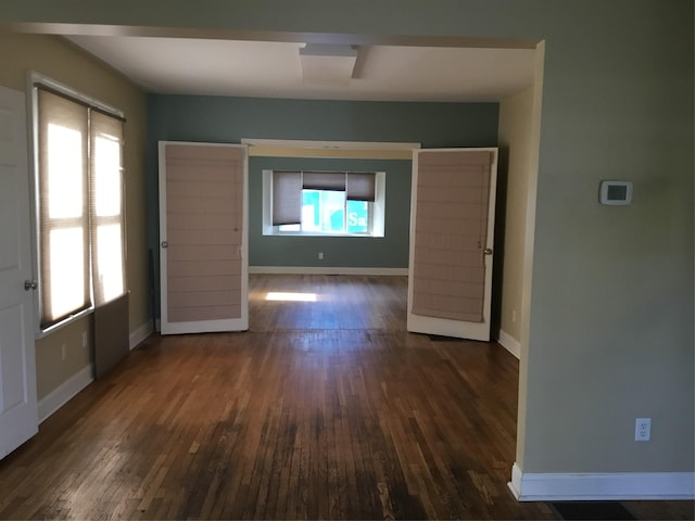 interior space with plenty of natural light, wood ceiling, and crown molding