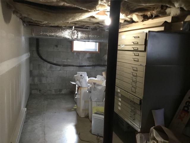 basement featuring a baseboard heating unit