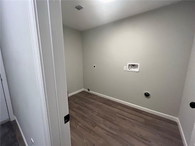 clothes washing area featuring washer hookup, electric dryer hookup, and dark wood-type flooring