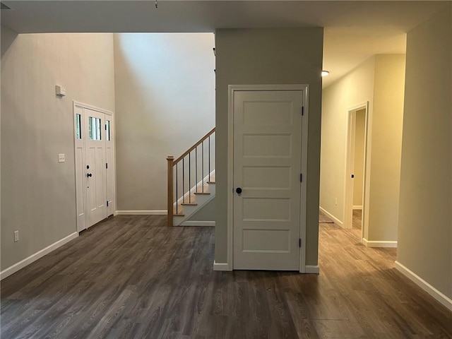 foyer entrance with dark wood-type flooring