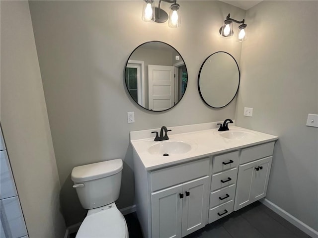 bathroom featuring vanity and toilet