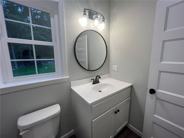 bathroom with vanity and toilet