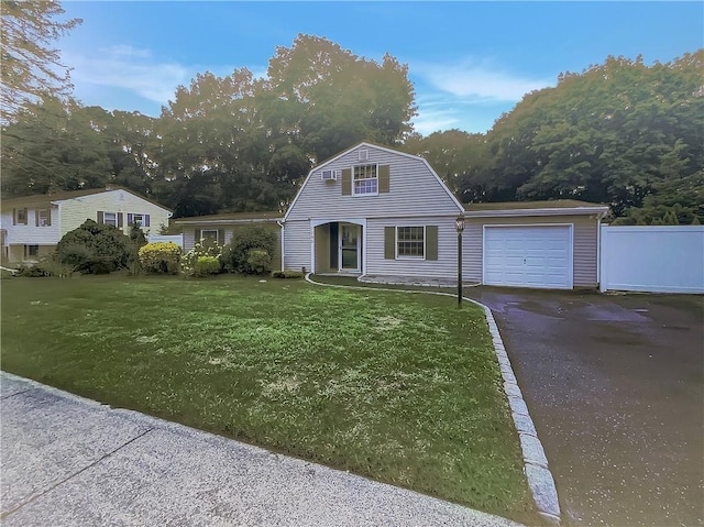 view of front of home featuring a front yard and a garage
