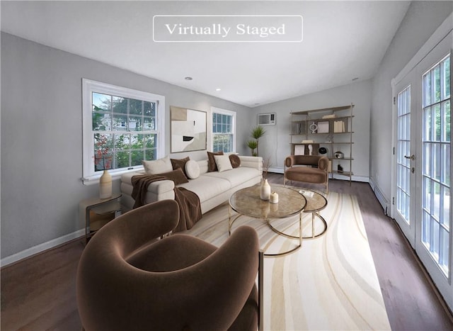 living room with a wall unit AC, french doors, dark wood-type flooring, and lofted ceiling