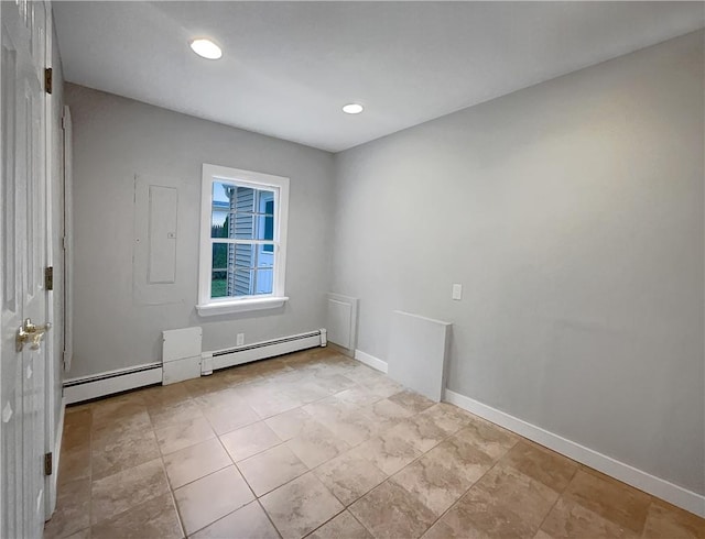 spare room with a baseboard heating unit