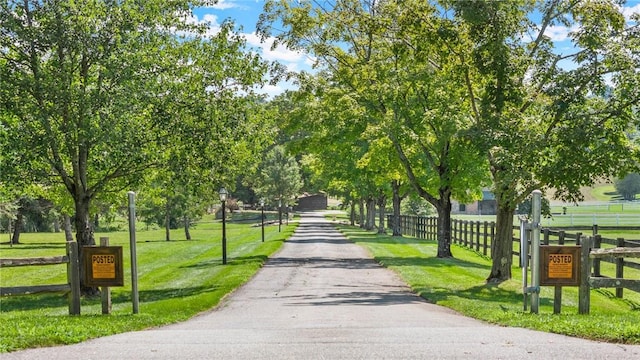 surrounding community featuring a yard