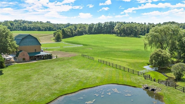 aerial view with a rural view and a water view