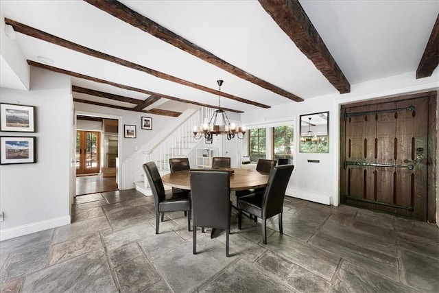 dining room featuring beamed ceiling, french doors, and a notable chandelier