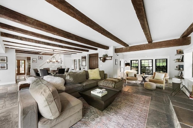 living room with beamed ceiling and an inviting chandelier