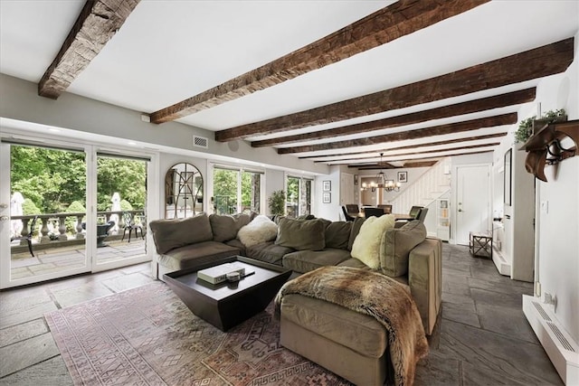 living room with beamed ceiling, a notable chandelier, and a baseboard radiator