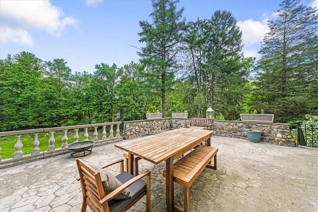 view of patio with a fire pit