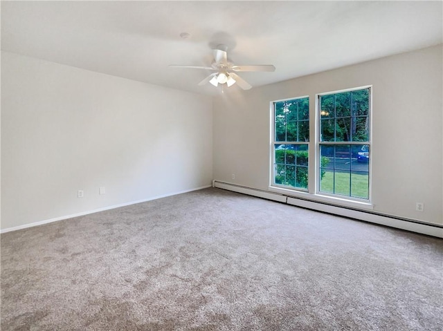 spare room featuring ceiling fan, carpet floors, and baseboard heating