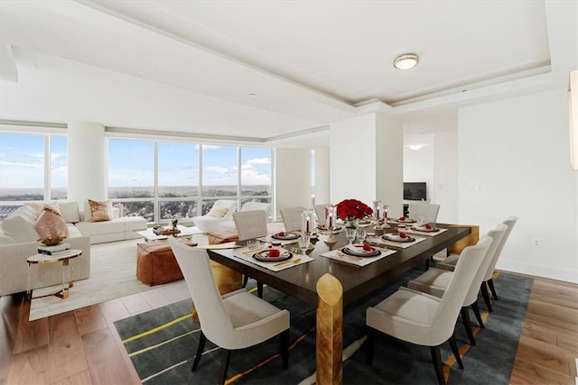 1 Renaissance Sq Unit Ph2Bc, White Plains, NY 10601 - dining space featuring wood finished floors and a tray ceiling