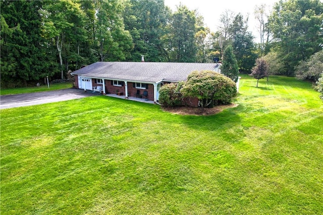 ranch-style home with a front yard