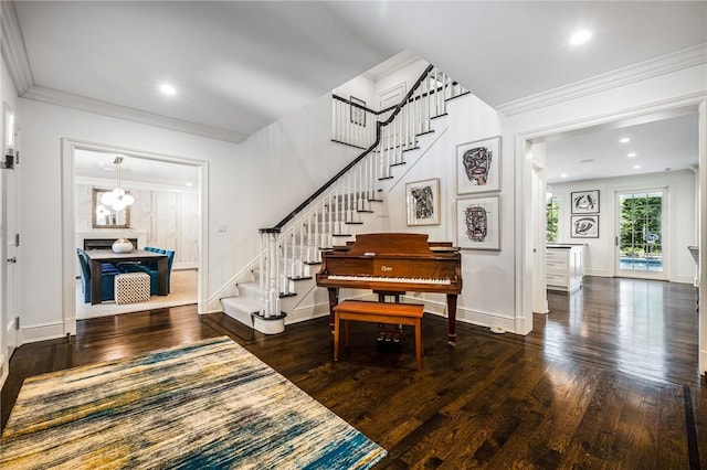 entryway featuring dark hardwood / wood-style floors and ornamental molding