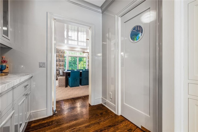 hallway with dark wood-type flooring