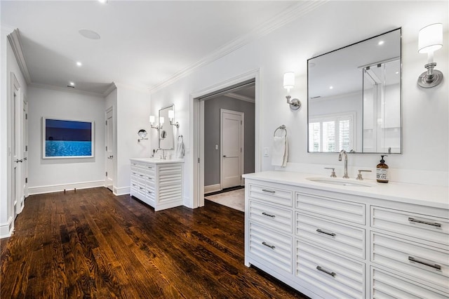 bathroom with vanity, wood-type flooring, and crown molding