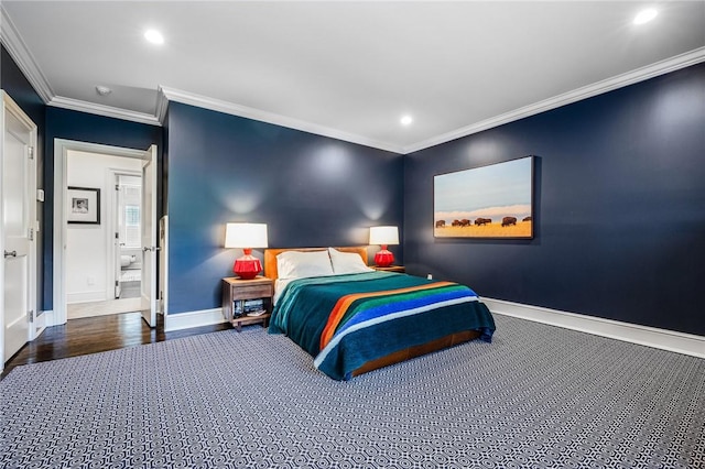 bedroom with dark hardwood / wood-style flooring and crown molding