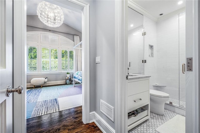 bathroom with an enclosed shower, wood-type flooring, a notable chandelier, toilet, and lofted ceiling