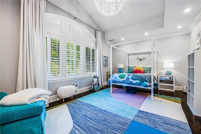 bedroom with dark hardwood / wood-style flooring, vaulted ceiling, an inviting chandelier, and crown molding