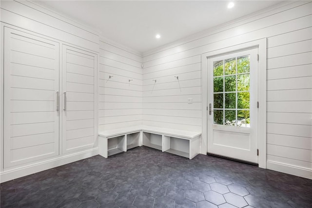 mudroom with wooden walls