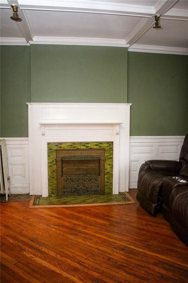 sitting room featuring hardwood / wood-style flooring, ornamental molding, beamed ceiling, and coffered ceiling