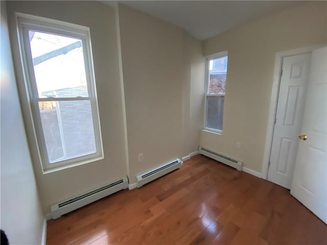 interior space featuring baseboard heating and plenty of natural light