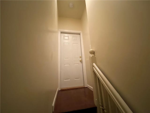 stairway with hardwood / wood-style floors