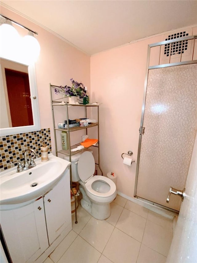 bathroom featuring decorative backsplash, vanity, toilet, and tile patterned flooring