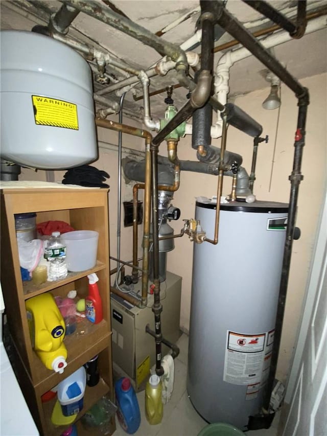 utility room featuring gas water heater