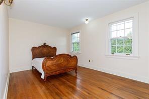 bedroom featuring wood-type flooring